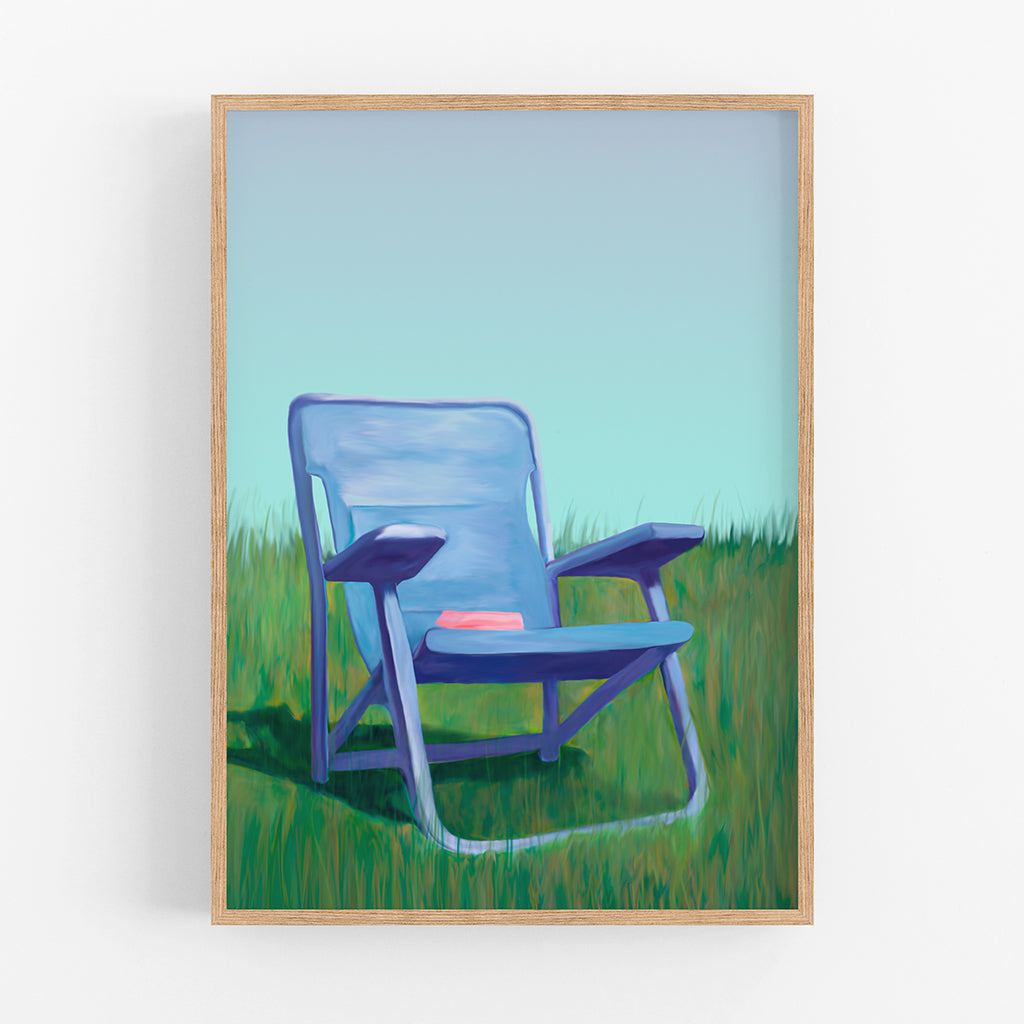 An art print of a blue lawn chair on grass.